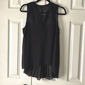 Women’s sleeveless top. Light/airy breathable. Loose pleated back, lace accents.